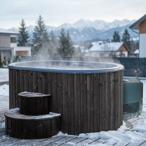 SaunaLife S2BC black cold plunge tub with steam rising in a snowy mountain backyard