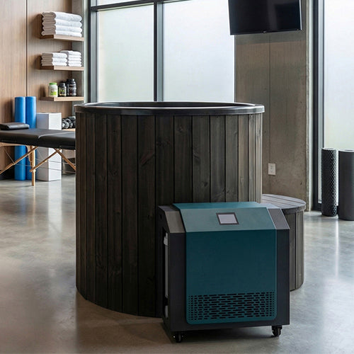 SaunaLife S1BC black cold plunge tub and chiller set up in an indoor wellness recovery studio
