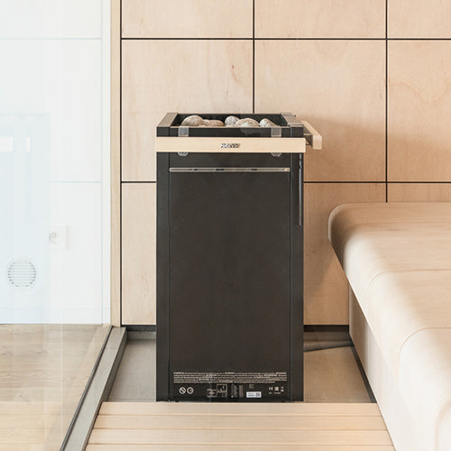 Harvia Virta HL80E sauna heater installed in a finished sauna