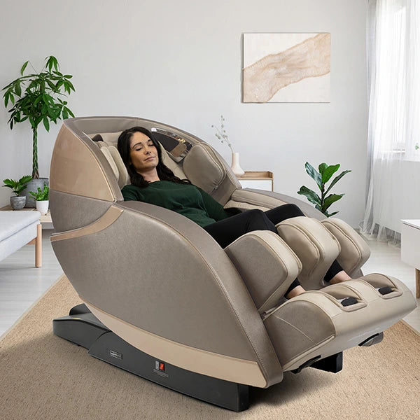 Kyota Kansha M878 massage chair in gold and tan used in a living room with zero gravity recline for full body relaxation