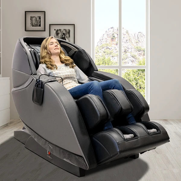 Woman relaxing in Kyota Kansha M878 massage chair with full body air compression and leg massage in a modern living room