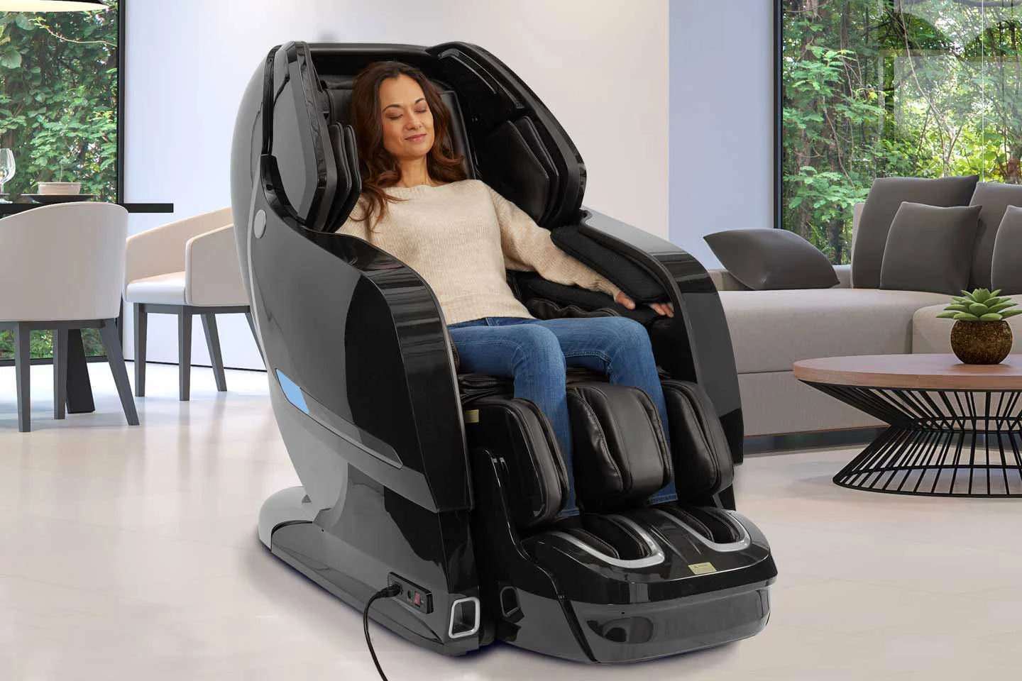 Kyota Yosei M868 4D massage chair in black with SL-Track, calf kneading, and zero gravity recline shown in a modern living room