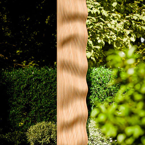 ThermaSol Ombra outdoor sauna exterior wave accent panel in thermally modified Ipe Lapacho wood with modern architectural design