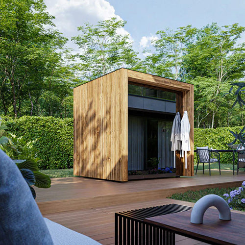 ThermaSol Fortis luxury outdoor sauna cabin with wood exterior and tinted glass front installed on modern backyard deck surrounded by greenery