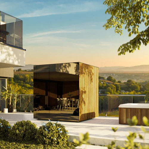 ThermaSol Spectra luxury outdoor sauna cabin with tinted glass front in modern architectural backyard setting